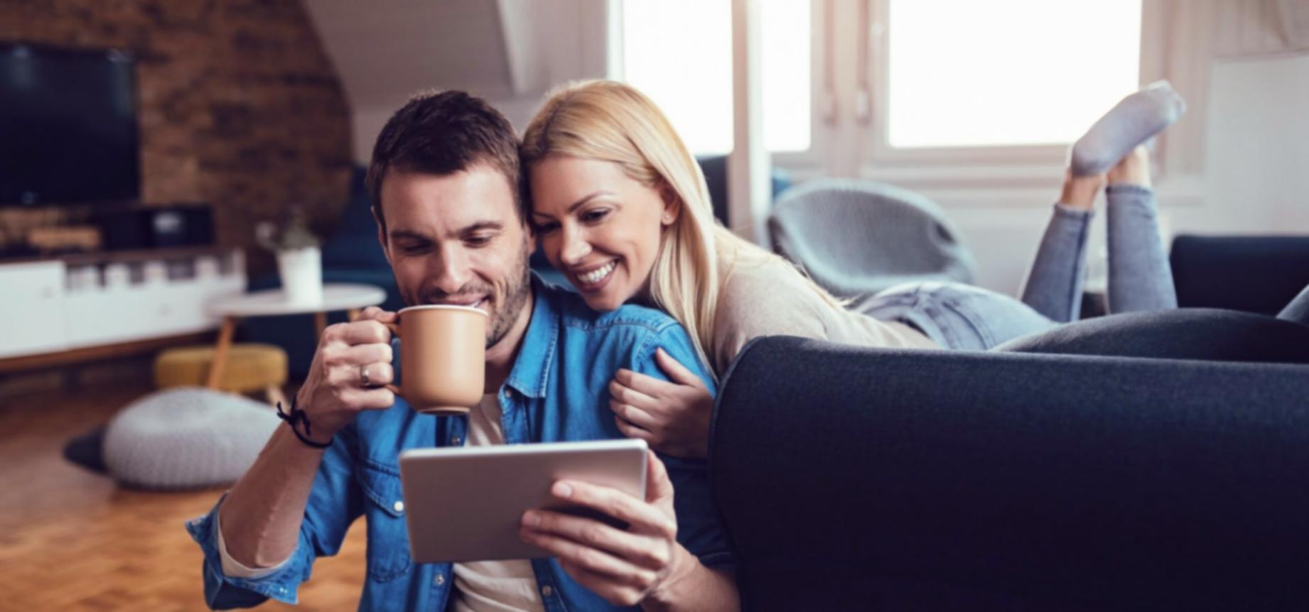 Student reviewing budget documents with calculator and notes